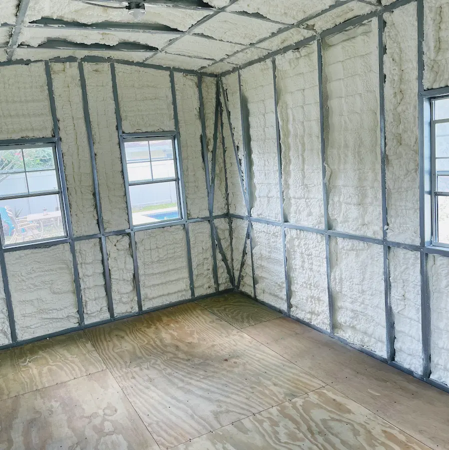 Closed-cell spray foam insulation applied to wall cavities in a residential project in Oakton